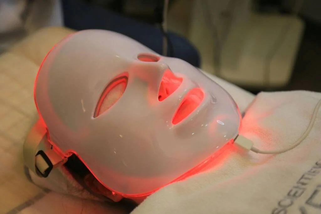 How does light therapy improve skin texture?
